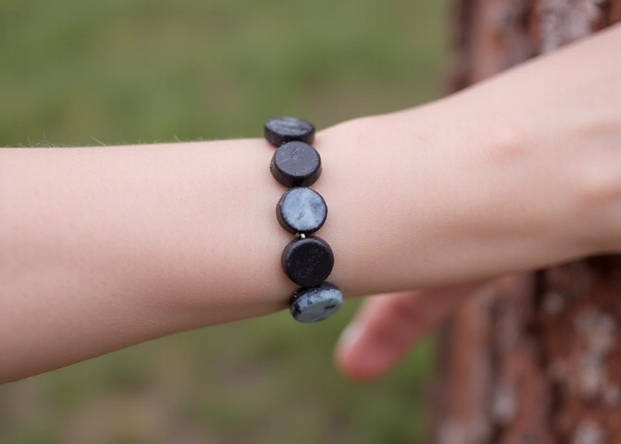 Stylish silicone focal bead bracelet on a wrist with a blurred background emphasizing the design.